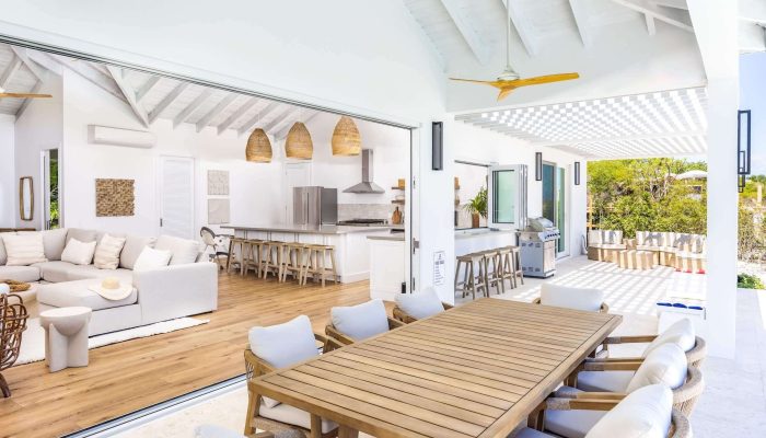 Open-air modern kitchen and dining area.