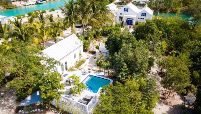 Aerial view of houses with a pool.