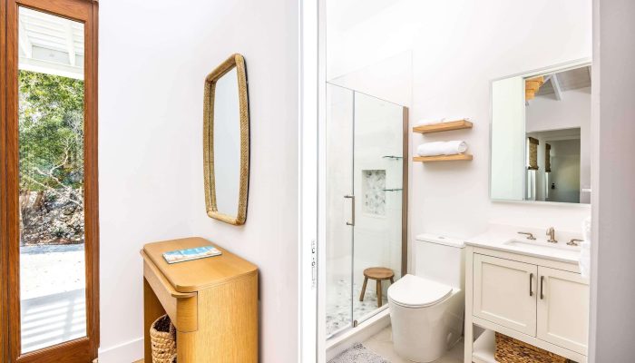 Modern bathroom with vanity and shower area.