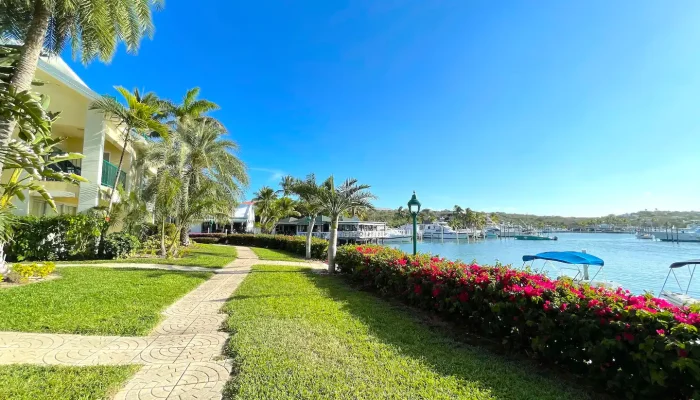 Pathway by tropical resort overlooking the ocean.