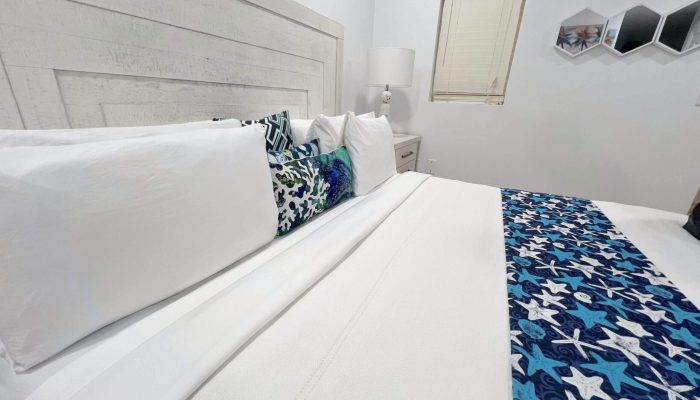 Cozy bedroom with starfish-themed bedding.