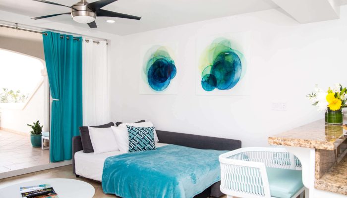 Modern living room with blue decor accents.