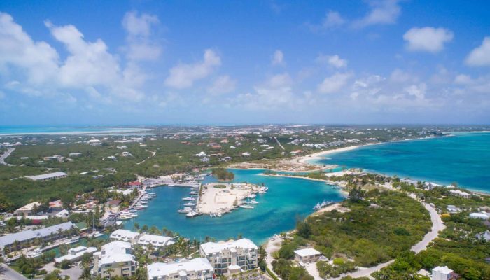 Aerial view of coastal town and marina.