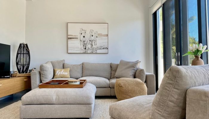 Cozy beige sectional sofa in sunlit living room