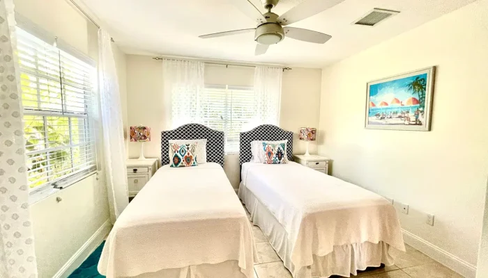 Bright bedroom with two single beds.